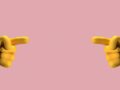 an animation of yellow hands on pink background