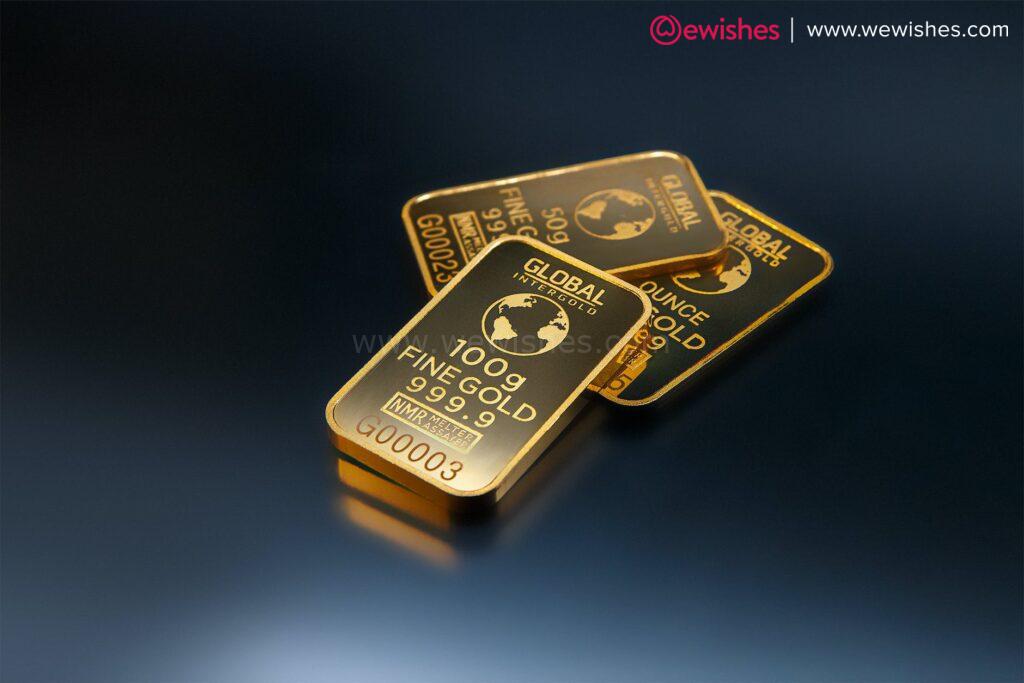 three gold bars against dark background